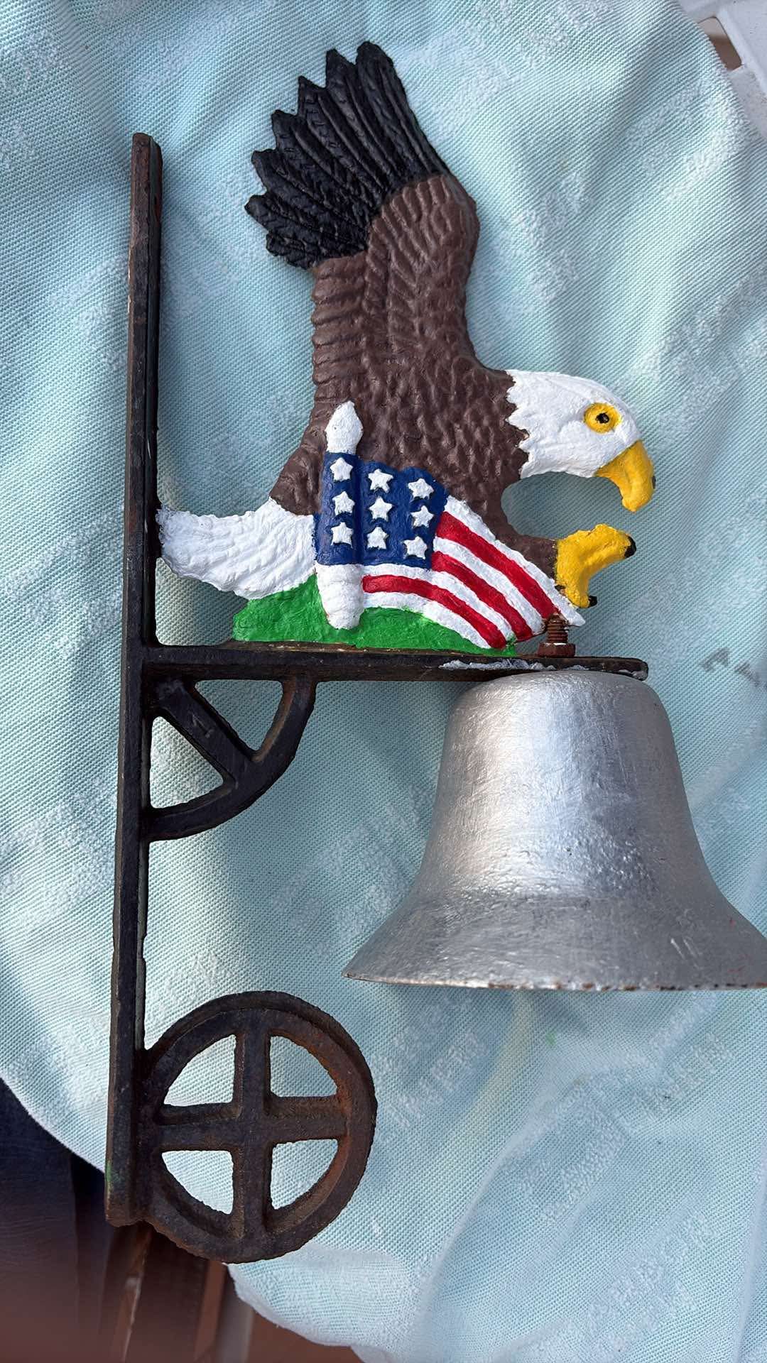 After: eagle bell repainted with a brown and white eagle, American flag and silver bell