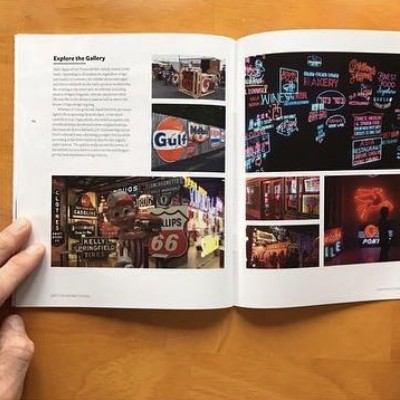 Explore the Gallery spread with a grid of vintage and neon sign photographs