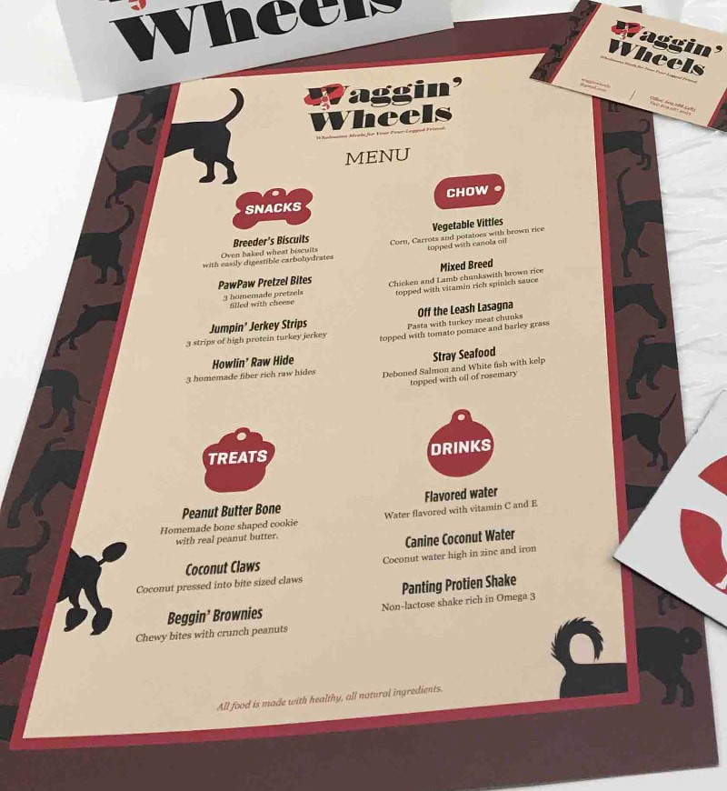 Waggin' Wheels menu with Snacks, Chow, Treats and Drinks sections framed by dog silhouettes